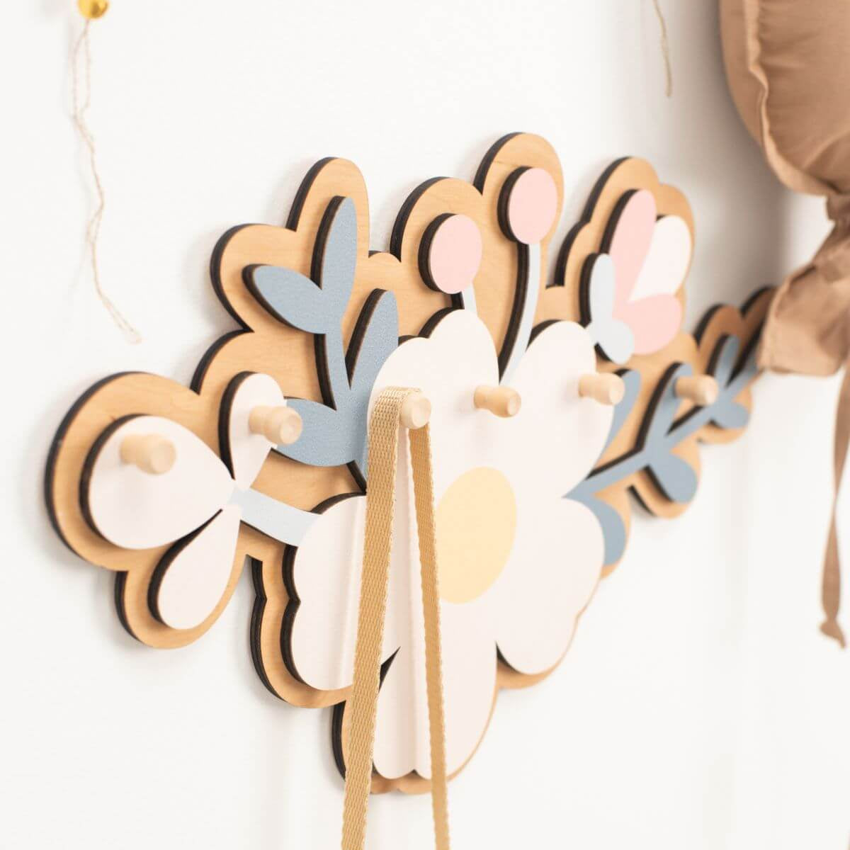 Decorative wall art with floral patterns on a white background