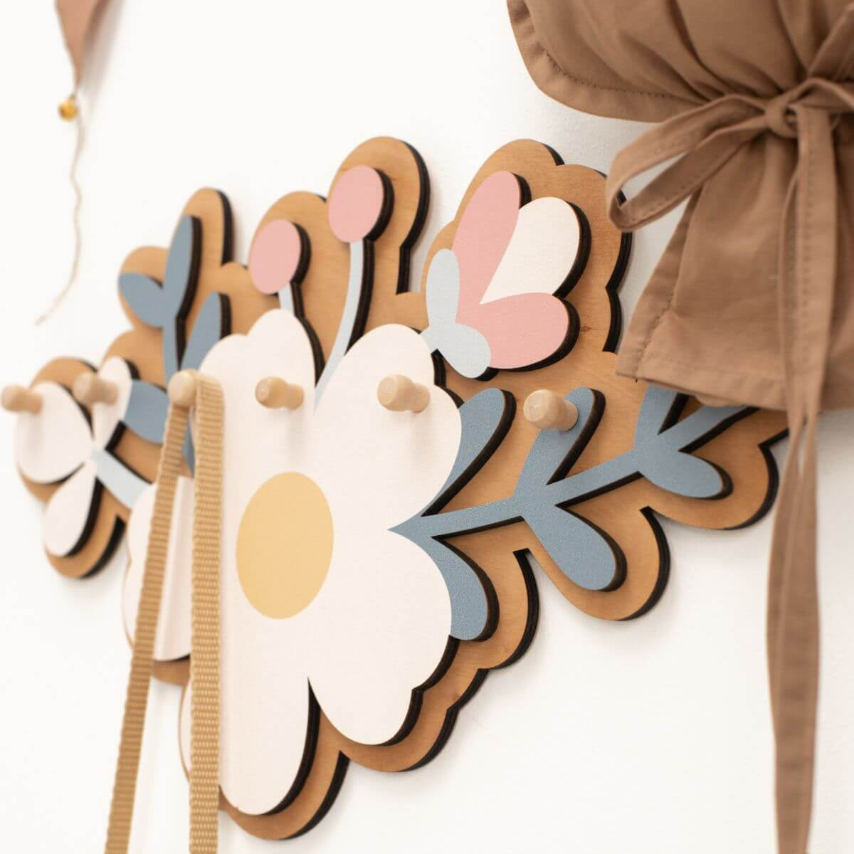 Decorative headbands with floral designs on a white background