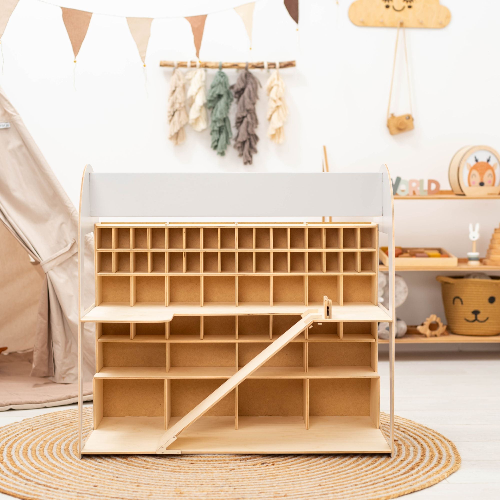 Wooden toy storage unit with shelves in a child's room